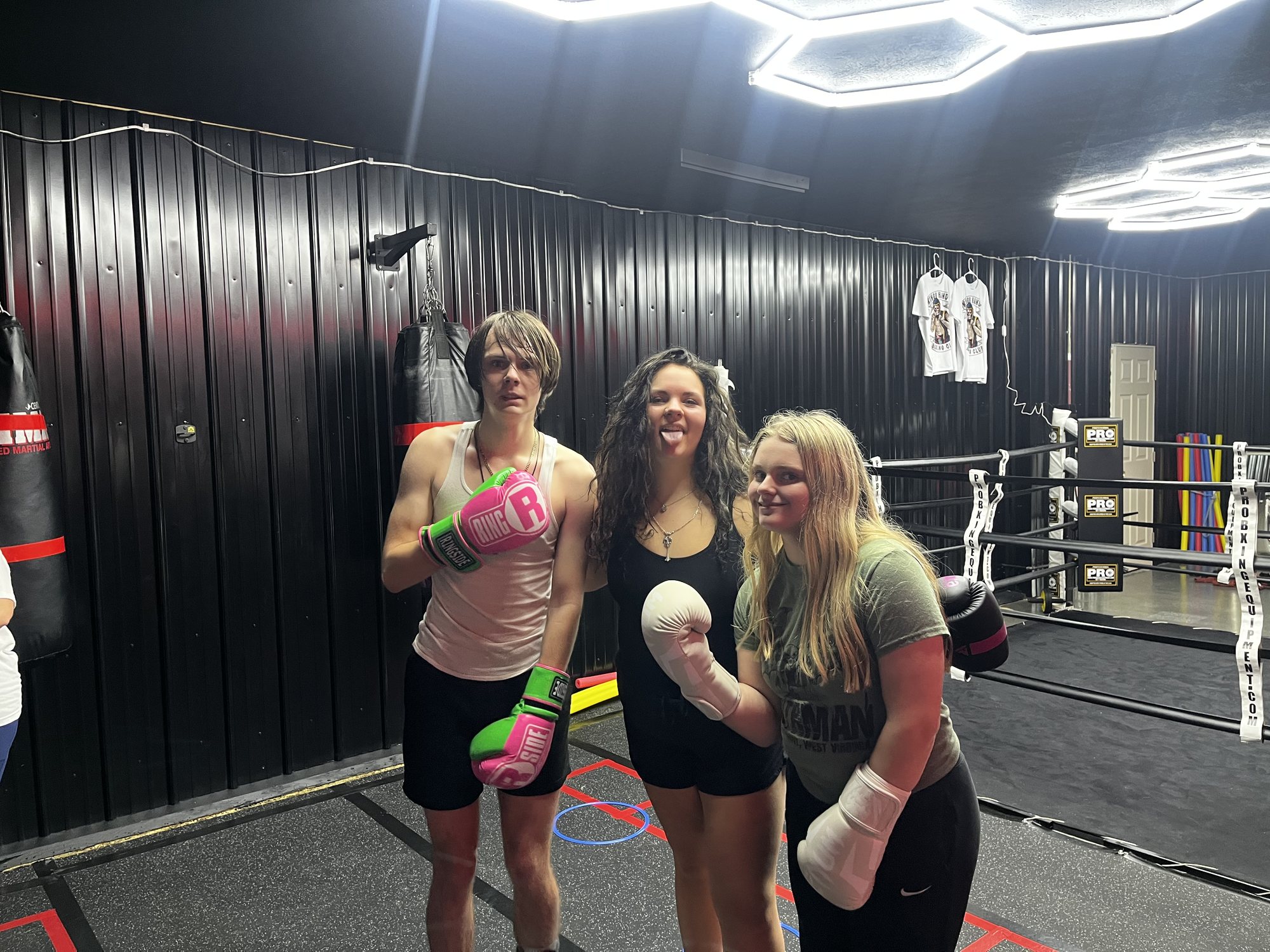 Three members ringside after a session